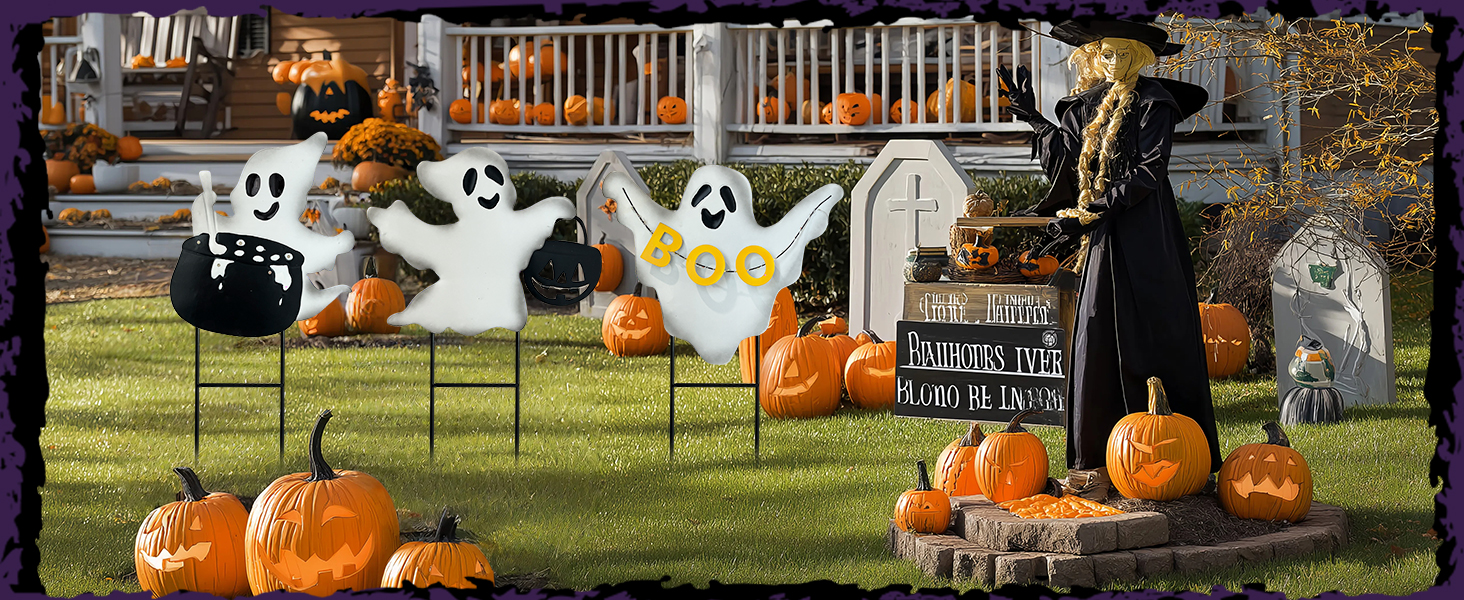 a halloween decorated garden with ghost garden stakes