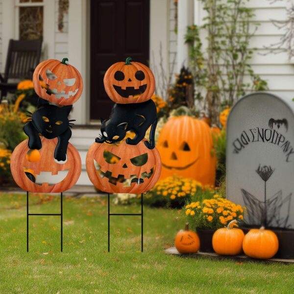 a frontyard of a halloween decorated garden stakes